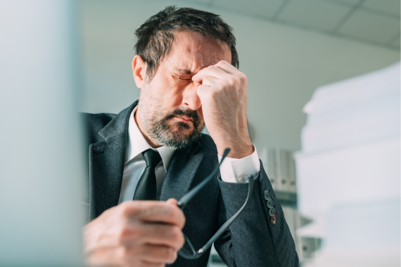 migraine-at-work-businessman-with-severe-painful-2022-04-12-06-48-41-utc