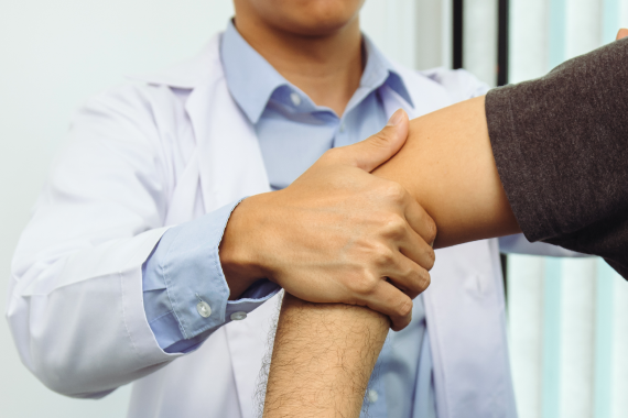 physical-therapists-press-to-the-patient-shoulder-2022-10-06-05-50-52-utc