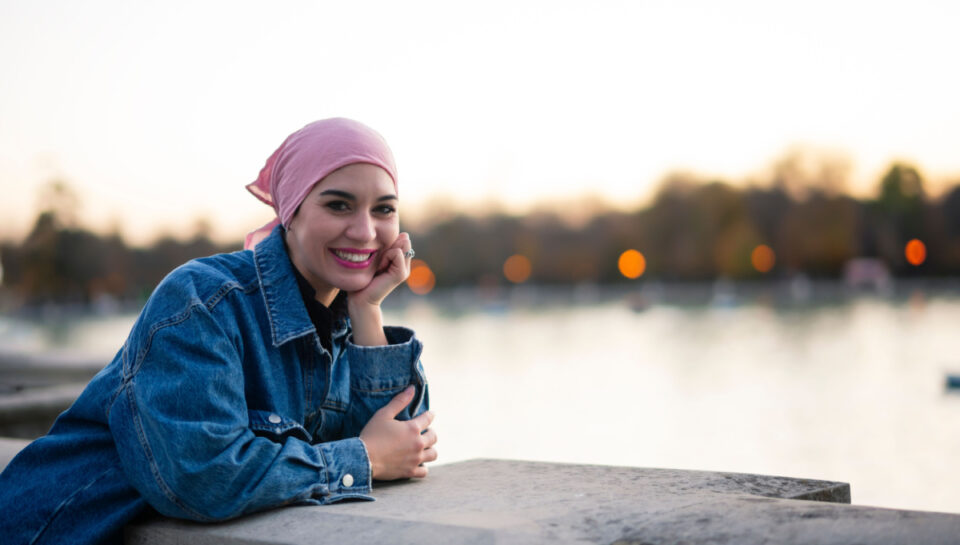 woman with cancer in front of lake