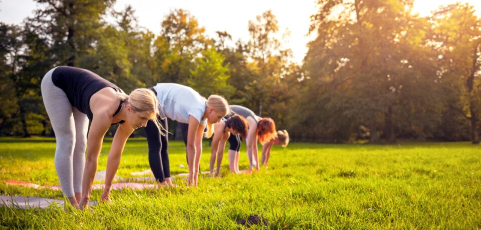 Mixed,Age,Group,Of,People,Practicing,Yoga,Outside,In,The Mixed,Age,Group,Of,People,Practicing,Yoga,Outside,In,The
