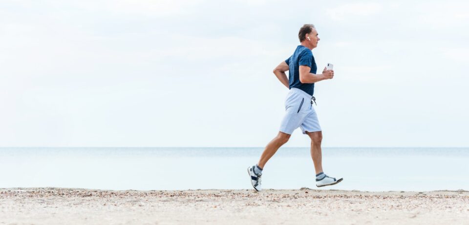 Elderly,Man,Runs,Early,Morning,By,Sea,Beach.,Active,Senior Elderly,Man,Runs,Early,Morning,By,Sea,Beach.,Active,Senior