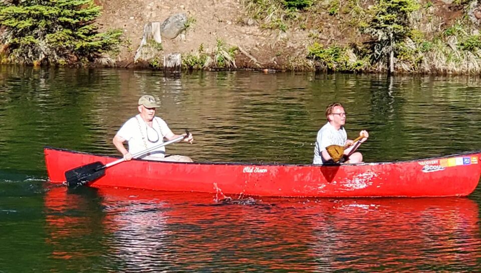 red canoe on lake